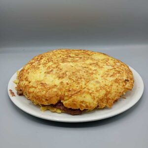 Tortilla rellena de pato confitado